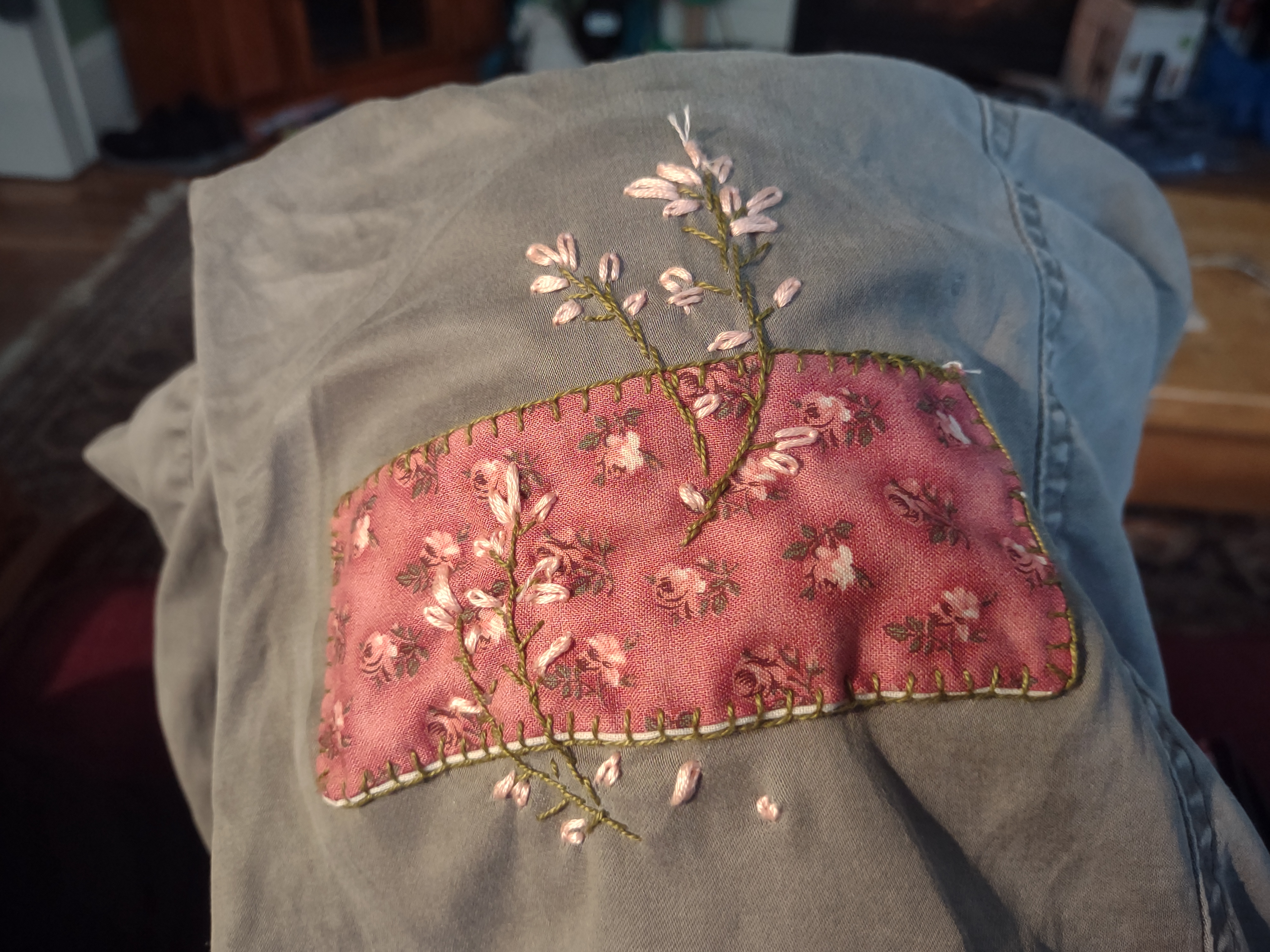 pink floral patch on green pants with pink flower embroidery